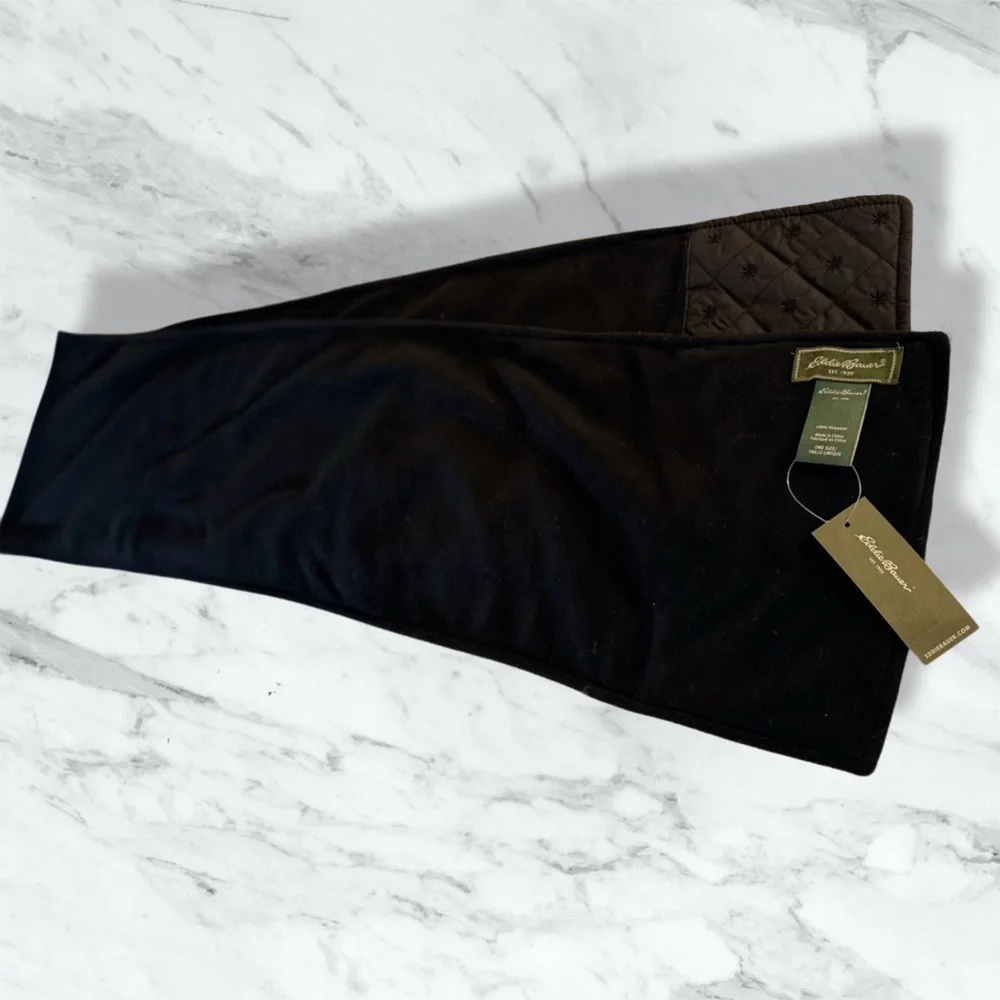 Eddie Bauer finely woven‎ fleece scarf in black with a quilted accent. 64” x 9”